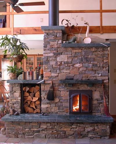 Choose an outer skin that suits your home decor style - here rough stones clad a masonry stove