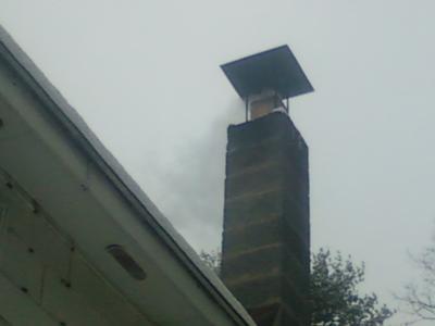 white smoke comming out of chimney